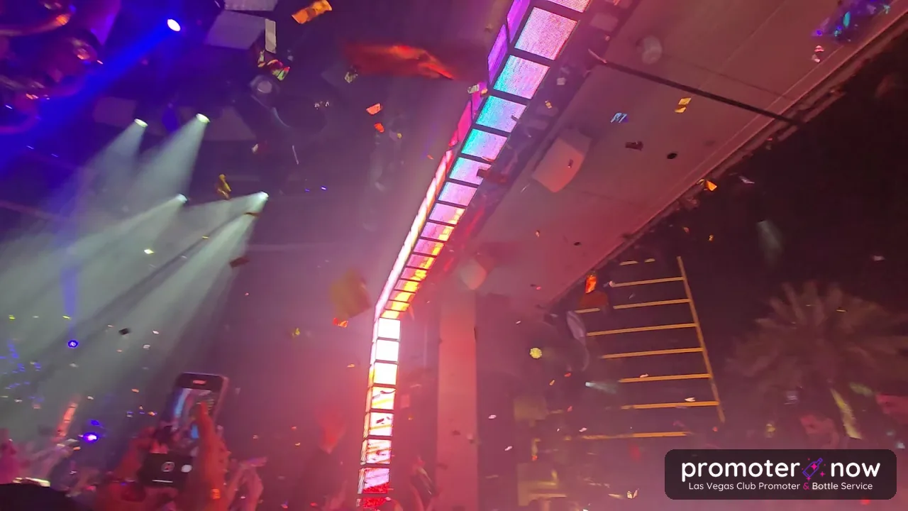 DJ dropping confetti over the crowd at XS Las Vegas